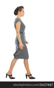 Business woman walking in corner