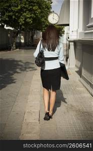 Business woman walking, outdoors