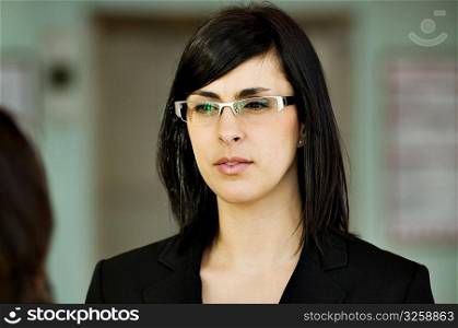 Business woman wearing stylish glasses.