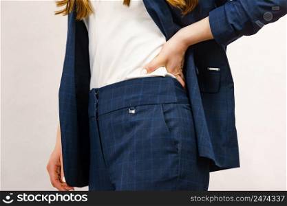 Business woman wearing suit. Detail view hips in trousers. Business woman in suit