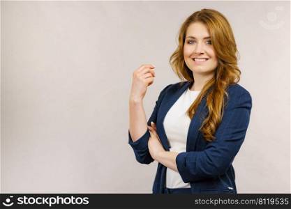 Business woman wearing suit looking at camera. Business woman in suit