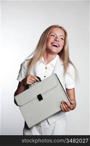 business woman with a briefcase on a gray background