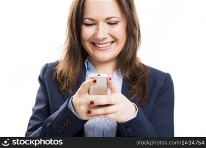 Business woman with a cellphone texting, isolated over white background
