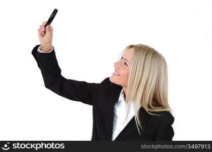 Business woman with a magnifying glass