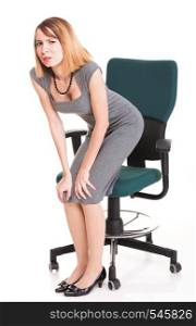 Business woman with back pain after long work on chair. Isolated on white background