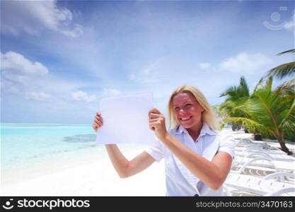 business woman with blank paper on the desolate ocean coast
