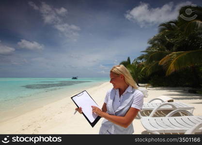 business woman with blank paper on the desolate ocean coast