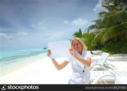 business woman with blank paper on the desolate ocean coast