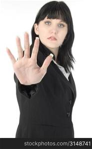 Business woman with hand out, palm open, toward camera. Focus on hand.