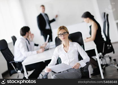 business woman with her staff, people group in background at modern bright office indoors