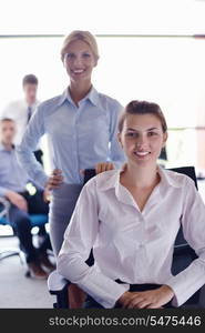 business woman with her staff, people group in background at modern bright office indoors