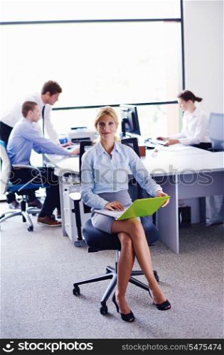business woman with her staff, people group in background at modern bright office indoors