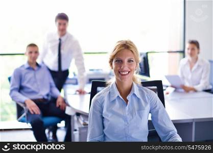 business woman with her staff, people group in background at modern bright office indoors