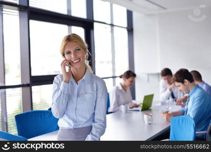 business woman with her staff, people group in background at modern bright office indoors