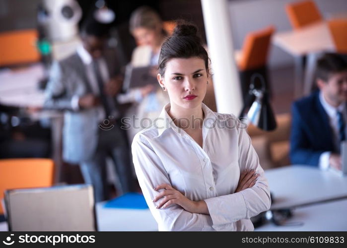 business woman with her staff, people group in background at modern bright office indoors