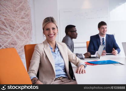 business woman with her staff, people group in background at modern bright office indoors