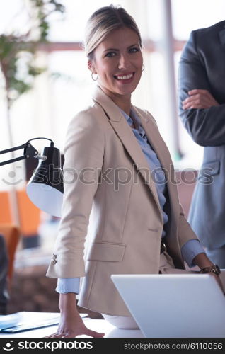 business woman with her staff, people group in background at modern bright office indoors