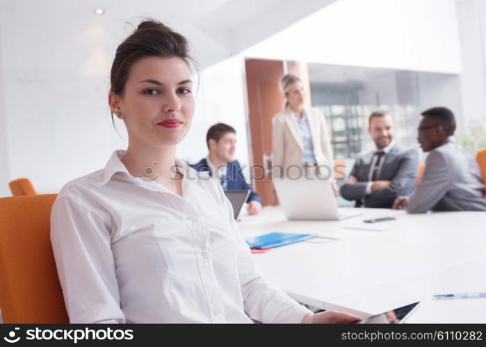 business woman with her staff, people group in background at modern bright office indoors