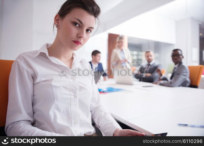 business woman with her staff, people group in background at modern bright office indoors