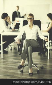 business woman with her staff, people group in background at modern bright office indoors