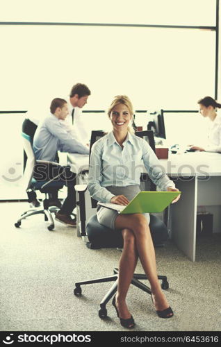 business woman with her staff, people group in background at modern bright office indoors