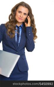 Business woman with laptop talking cell phone