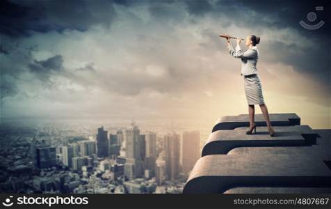 Business woman with telescope. Image of businesswoman looking in telescope standing a top of building