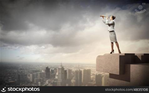 Business woman with telescope. Image of businesswoman looking in telescope standing a top of building