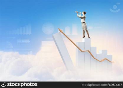 Business woman with telescope. Image of businesswoman looking in telescope standing against clouds background