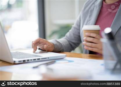 Business Woman working by using laptop computer Hands typing on a keyboard. Professional investor working new start up project. business planning in office. Technology business Concept