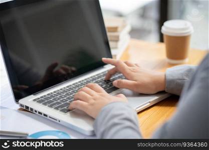 Business Woman working by using laptop computer Hands typing on a keyboard. Professional investor working new start up project. business planning in office. Technology business Concept. 