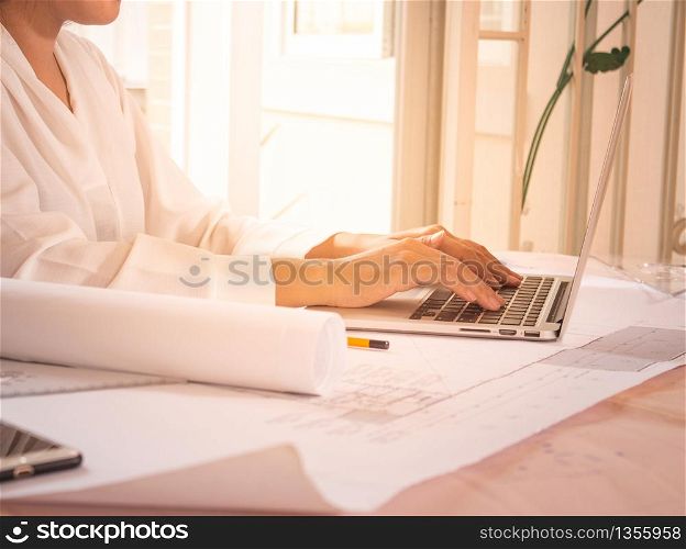 business woman working in office with laptop