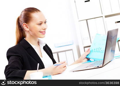 Business woman working on computer in office