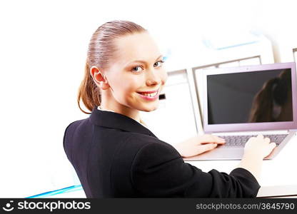 Business woman working on computer in office