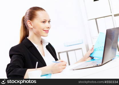 Business woman working on computer in office