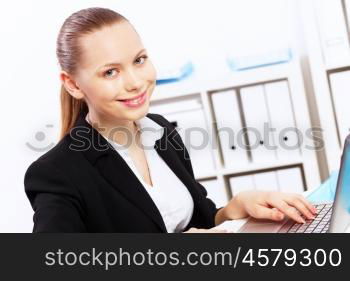 Business woman working on computer in office