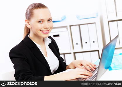 Business woman working on computer in office