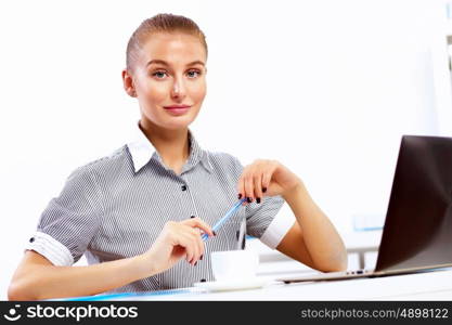 Business woman working on computer in office