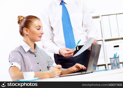 Business woman working on computer in office