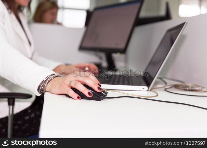 Business woman working on computer in the office