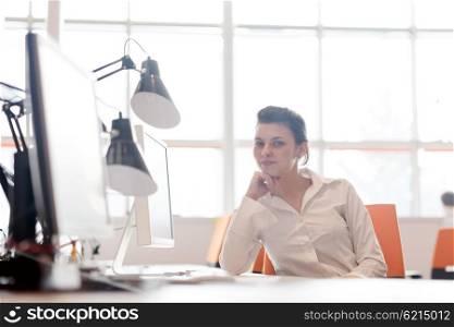 business woman working on desktop computer at modern startup office