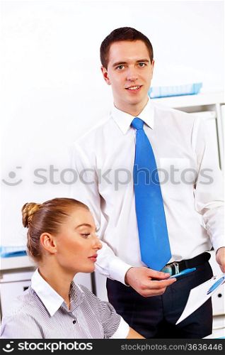 Business woman working with her collegue in office