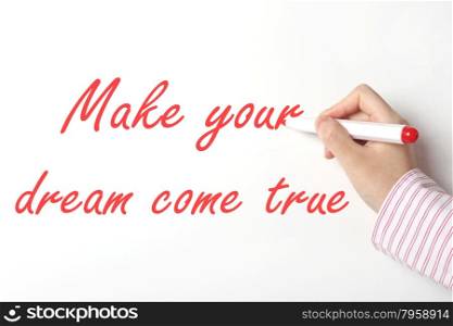Business woman writing make your dream come true word on whiteboard