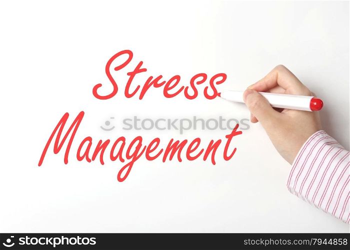 Business woman writing stress management word on whiteboard