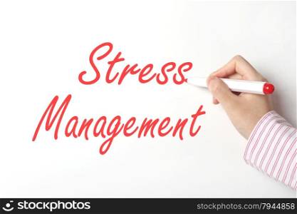 Business woman writing stress management word on whiteboard