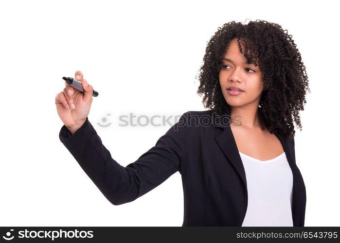 Business woman writing with marker on virtual screen. A beautiful african business woman writing with marker on virtual screen, isolated over white