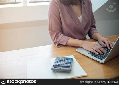 Business women checking bills. taxes bank account balance and calculating annual financial statements of company. Accounting Audit Concept.