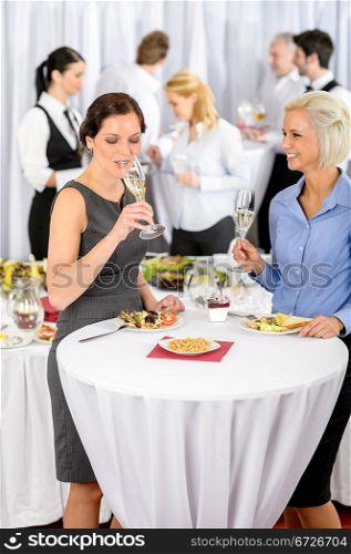 Business women drink aperitif during company seminar meeting