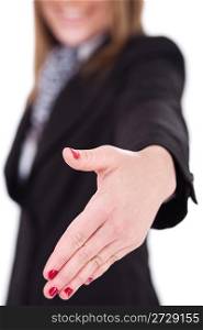 Business women offering a hand shake, focus on hand