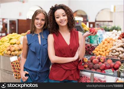 Business women presenting their organic greengrocer
